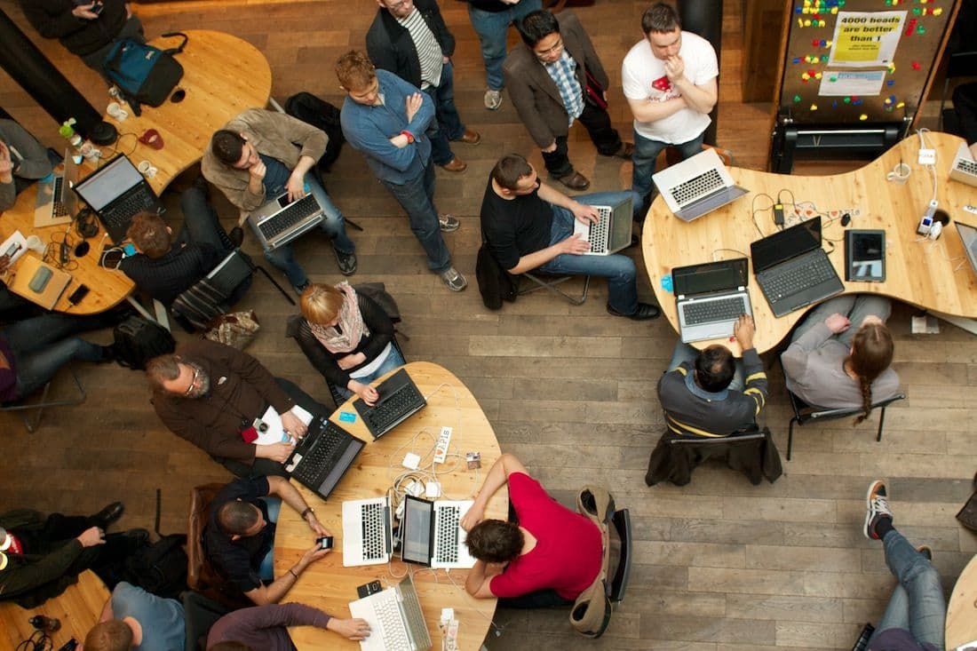 SYNC Hackathon participants collaborating at the venue